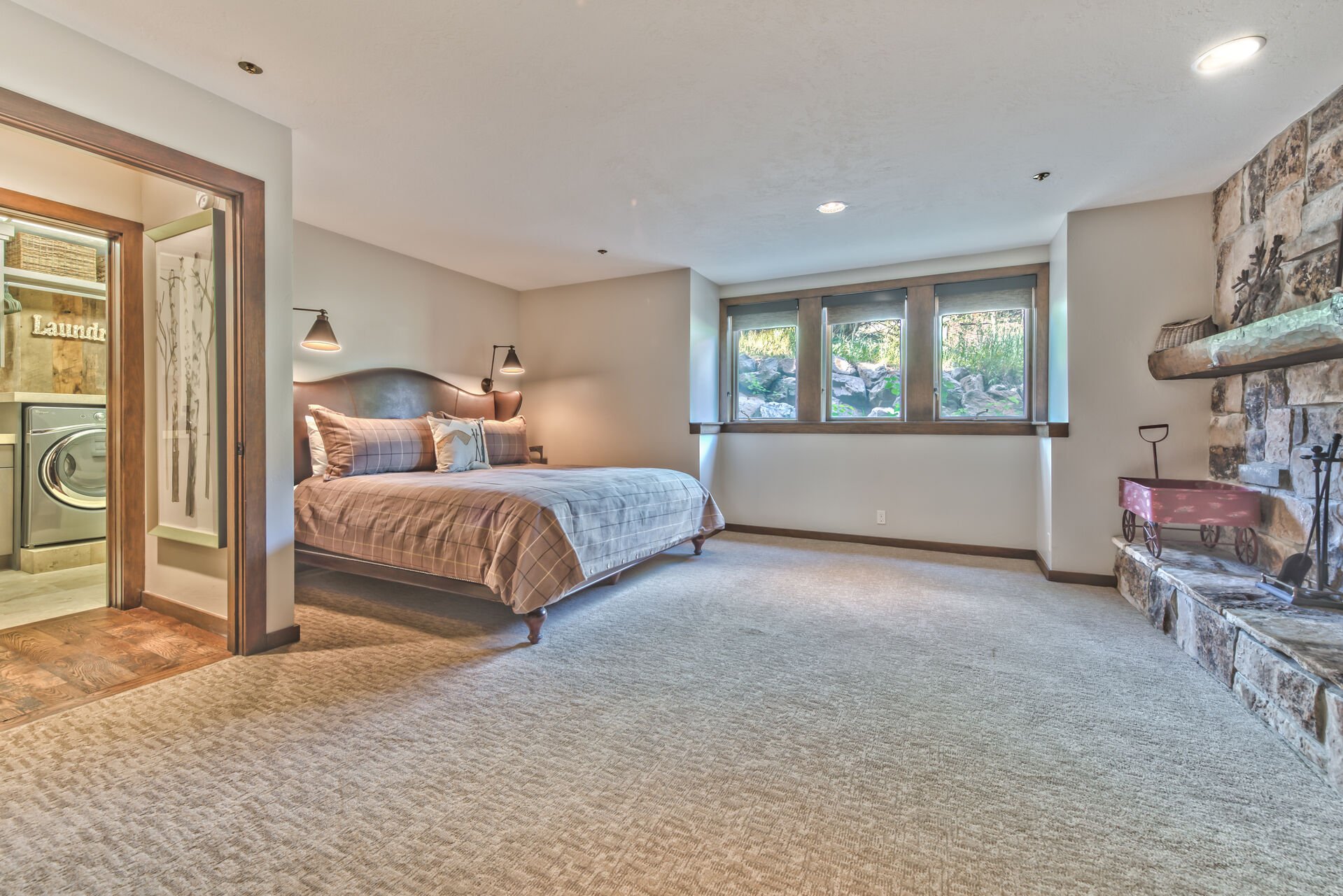Lower Level Master Bedroom with King Bed, Smart TV, Wood Fireplace and Private Bath with a Tile Shower