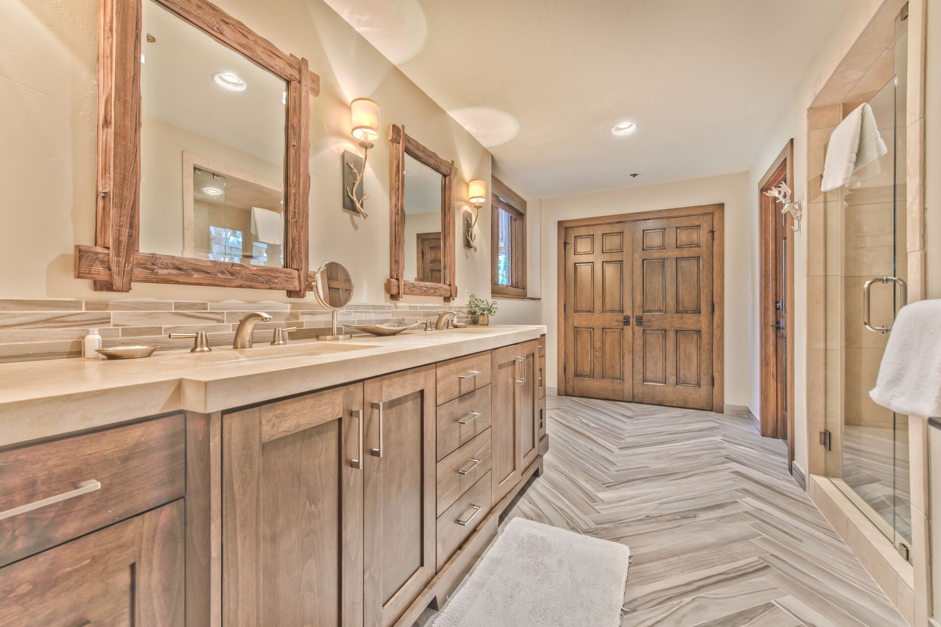 Lower Level Private Master Bath with Dual Sinks and a Tile Shower