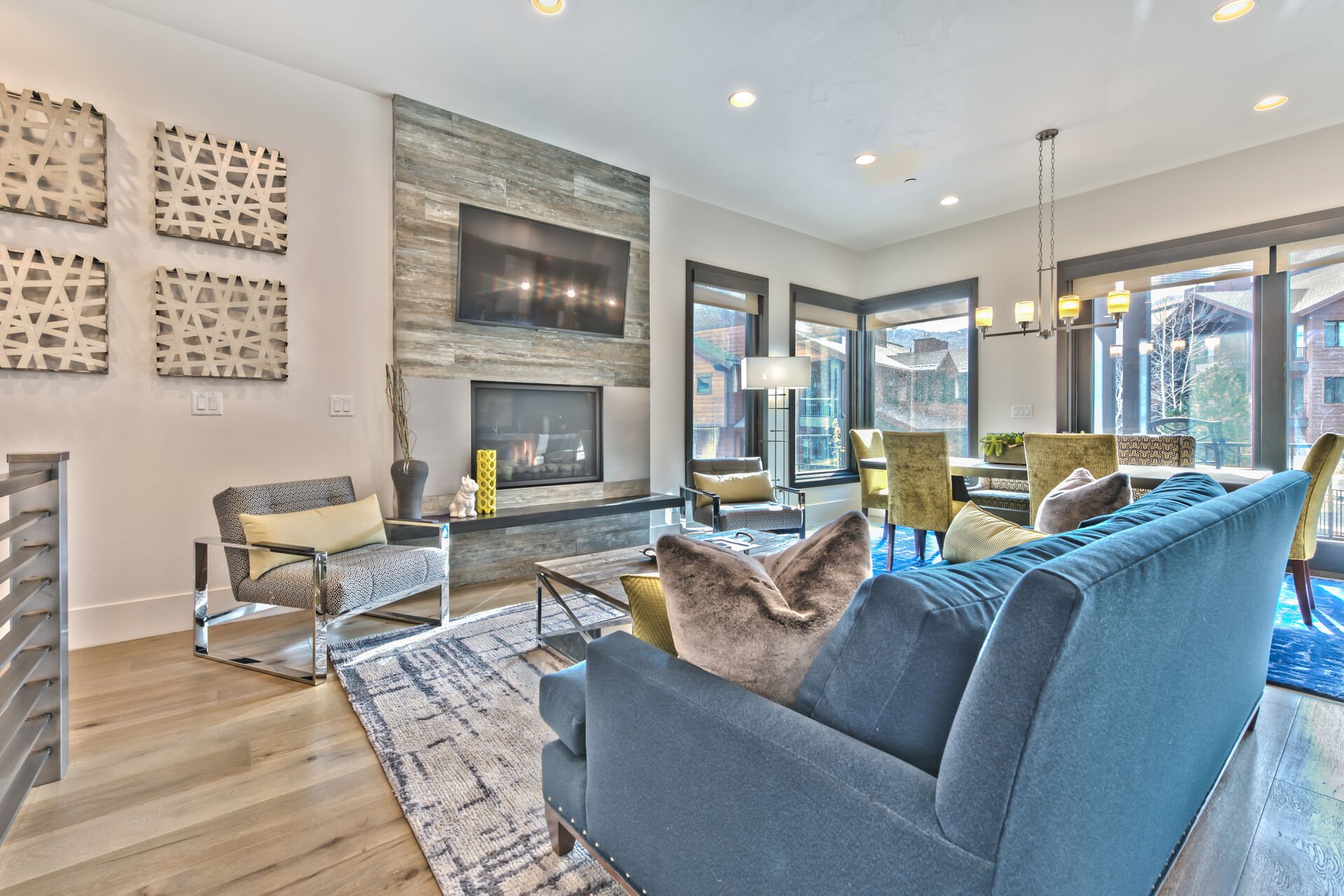 Mountain Contemporary Furnishings Surround a Warm Gas Fireplace and Large Flat Screen TV