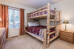 Guest bedroom (Bunk room) with Full bed over Queen bed and flat screen TV