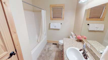 This clean, quaint bathroom is located on the main floor also.