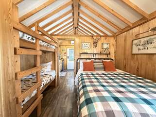 Along with the queen are two small bunkbeds for your little ones.