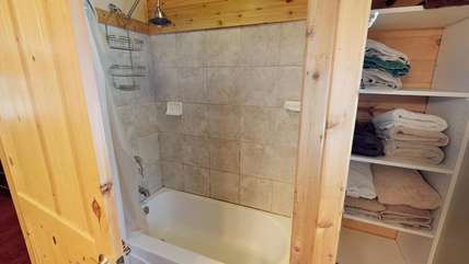 Private master bathroom has a tub and shower combo