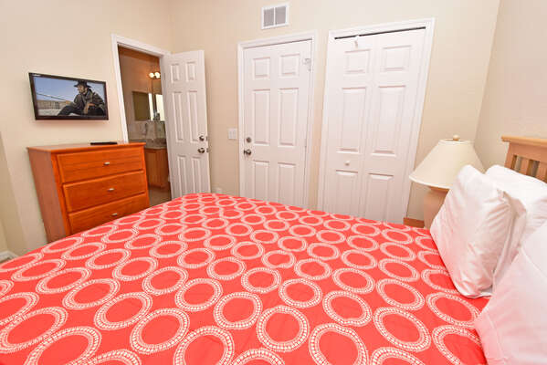 Bedroom 2 showing flatscreen, closet and en-suite bathroom