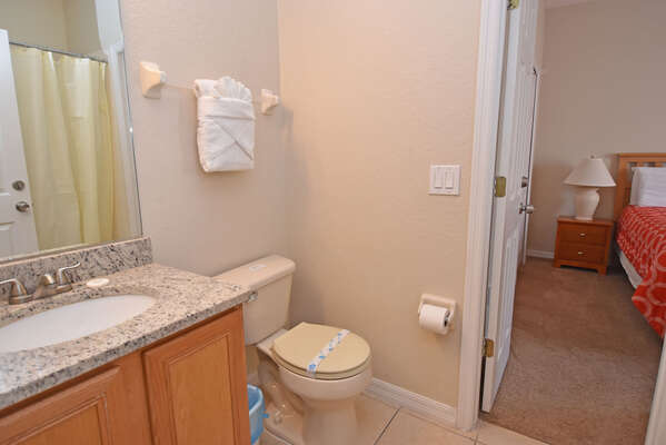 Bedroom 2 bathroom has bath/shower combo and single basin vanity.  Shared by main house (downstairs)