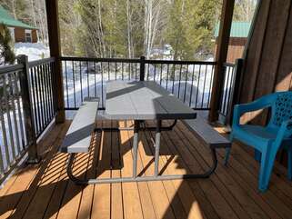 Picnic table by the hot tub to hangout while kids are in the hot tub or eat outside.