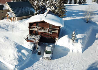 Aerial shot of the cabin in the winter.