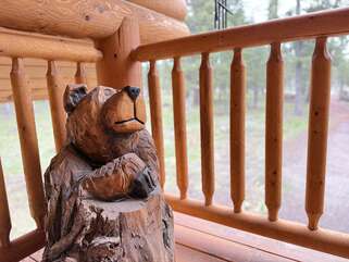 Carved bear on the balcony overlooking driveway