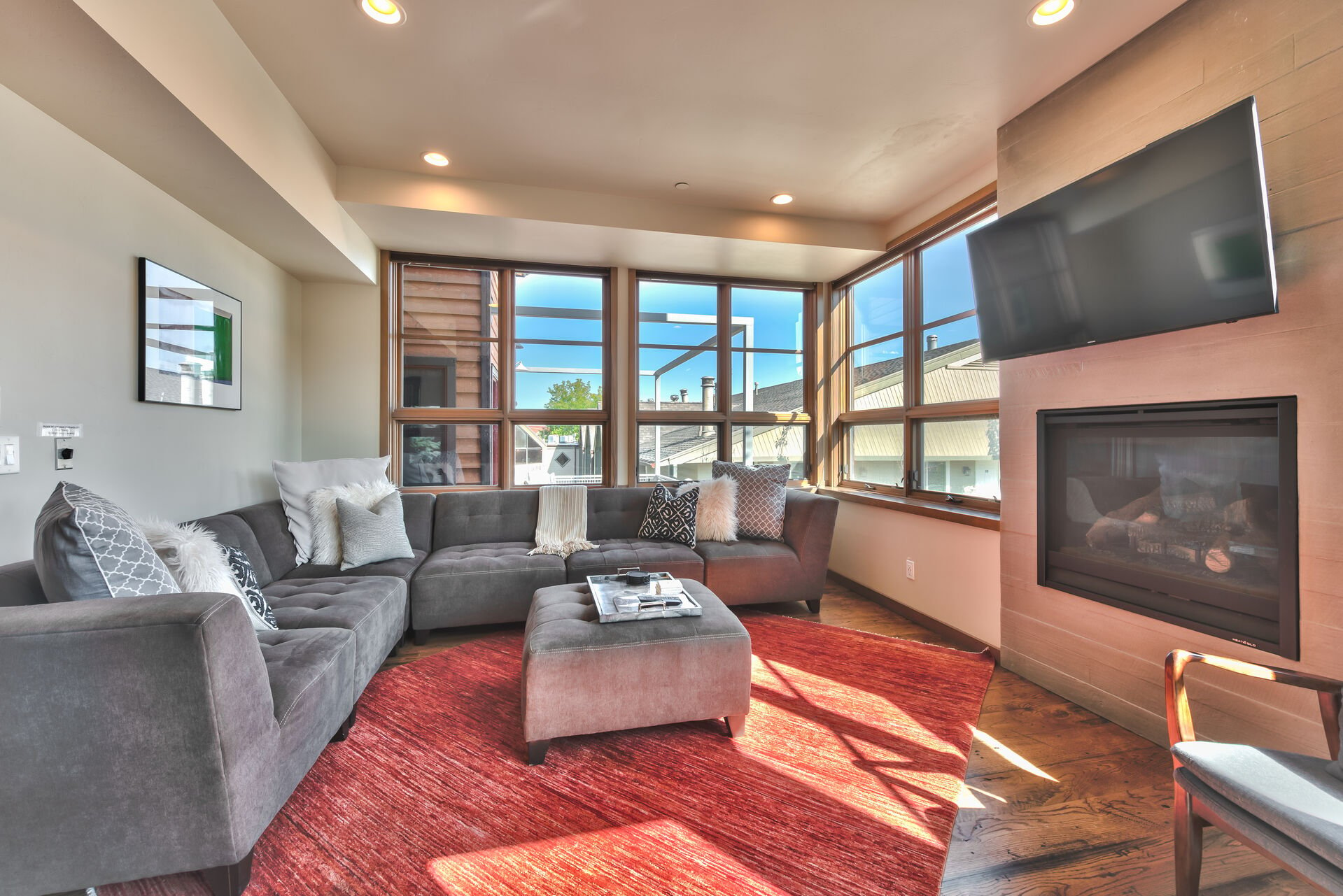 Level 2 - Living Room with Contemporary Furnishings, Gas Fireplace, TV, and Mountain Views