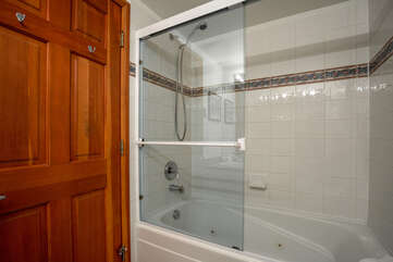 Bathroom with shower over tub