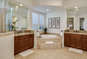 Primary en suite bath with soaking tub, walk-in shower and dual vanity.