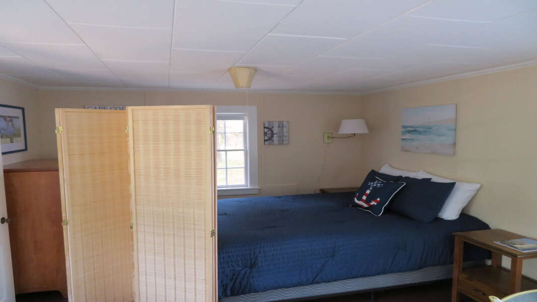 USe the privacy screen ( shown partially open) Queen bed located in the living area - 1047 Old Queen Anne Road Chatham Cape Cod - New England Vacation Rentals