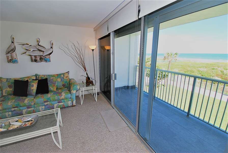 Living room overlooking balcony to beach