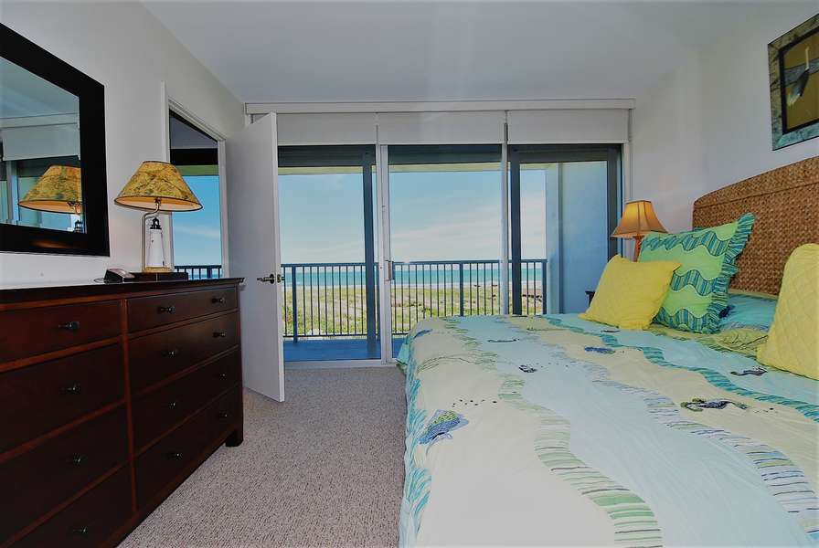 Master bedroom overlooking balcony to beach