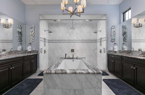 Large ensuite bathroom with amazing jacuzzi tub and glass door walk-in shower