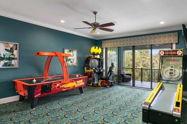 Second floor games room features a Batman Racing Arcade, Skee-Ball, and Air hockey table