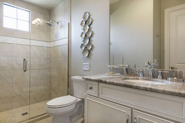 Master en-suite bathroom with glass door walk-in shower
