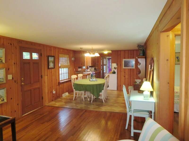 View of the open living/dining/kitchen area, there is even a small desk to write out post cards or catch up on work! - 23 Ginger Plum Lane Harwich Port Cape Cod - New England Vacation Rental