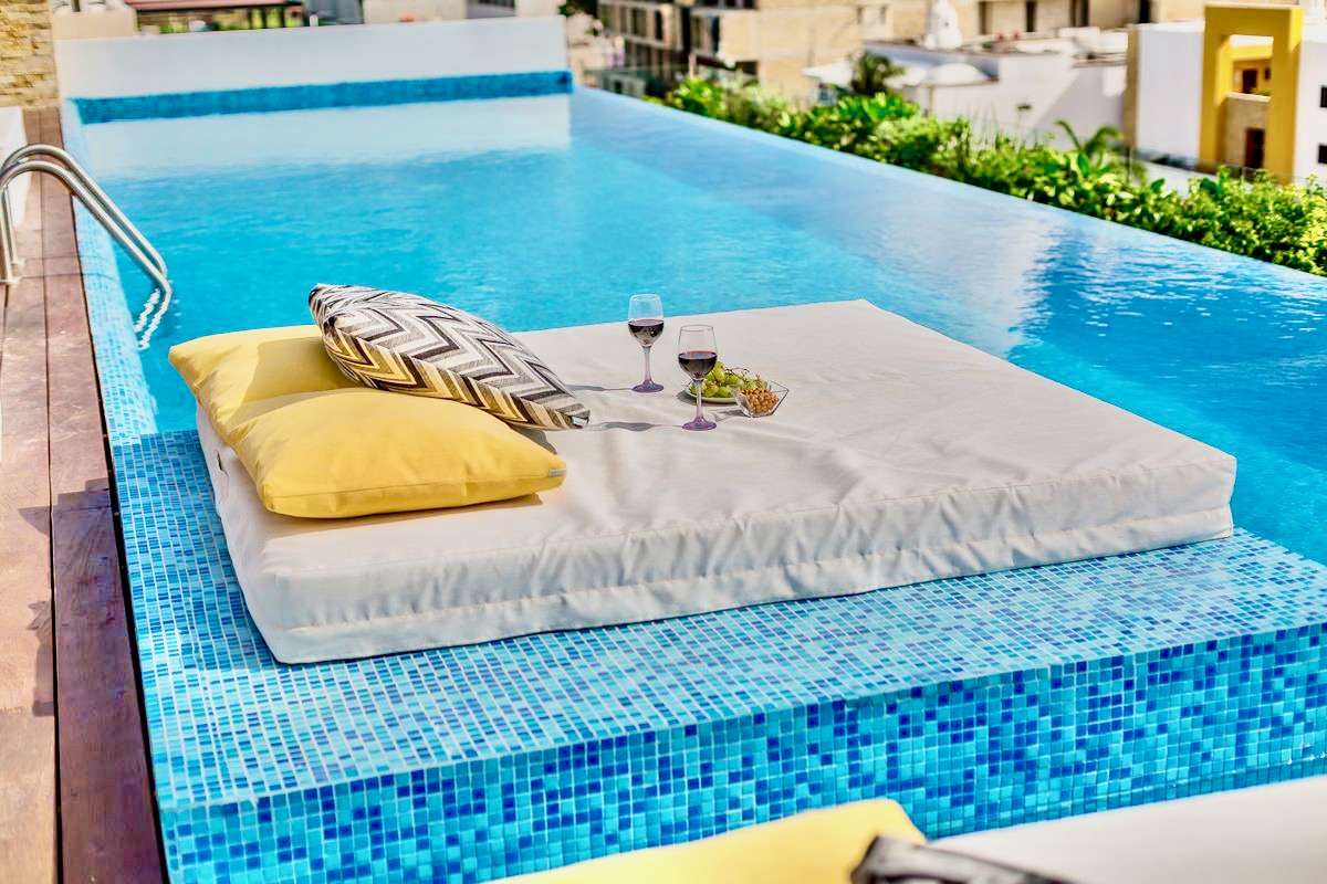Beautiful swimming pool with small bed