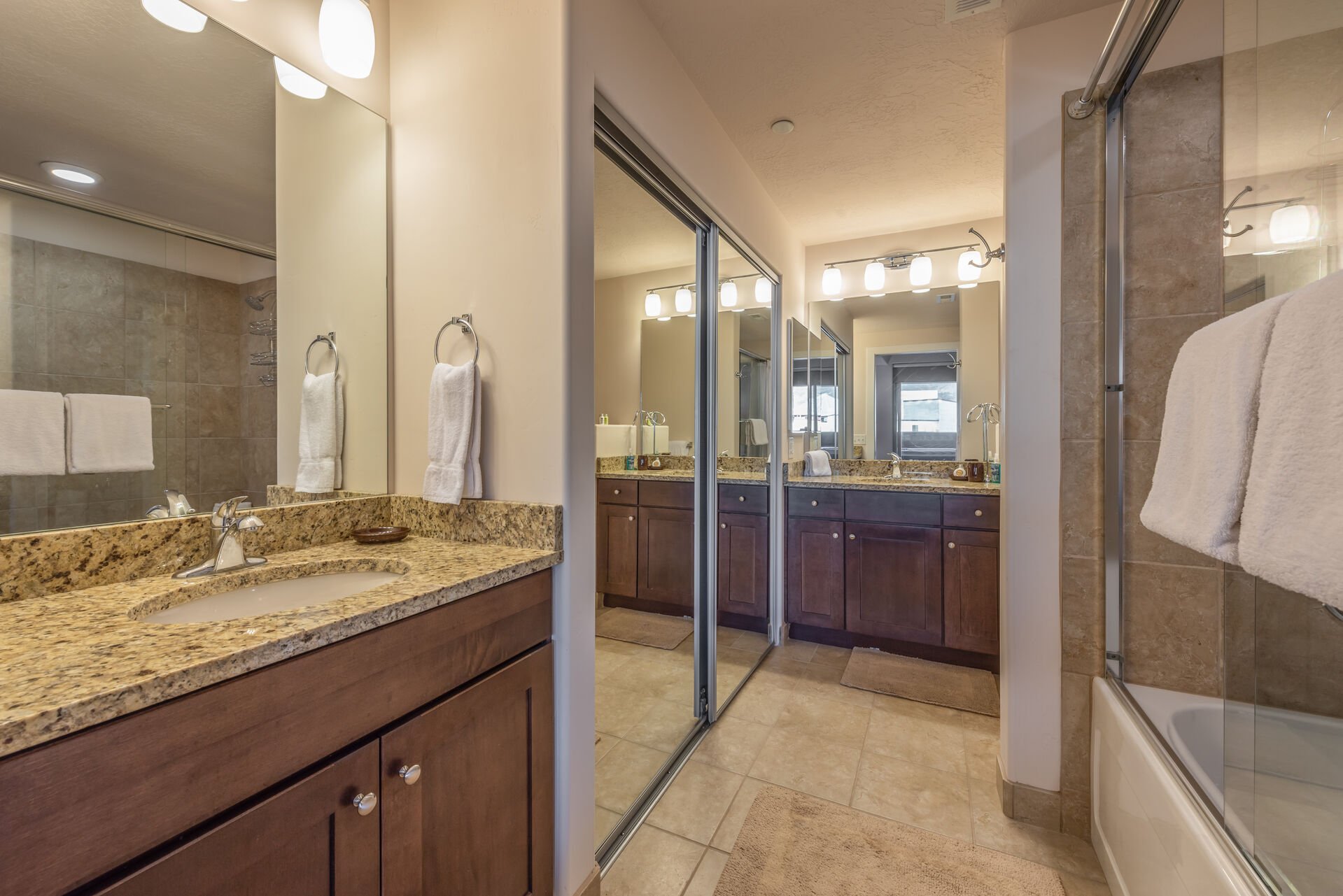 Master Bath 1 with Separate Vanities and a Large Soaking Tub/Shower Combo