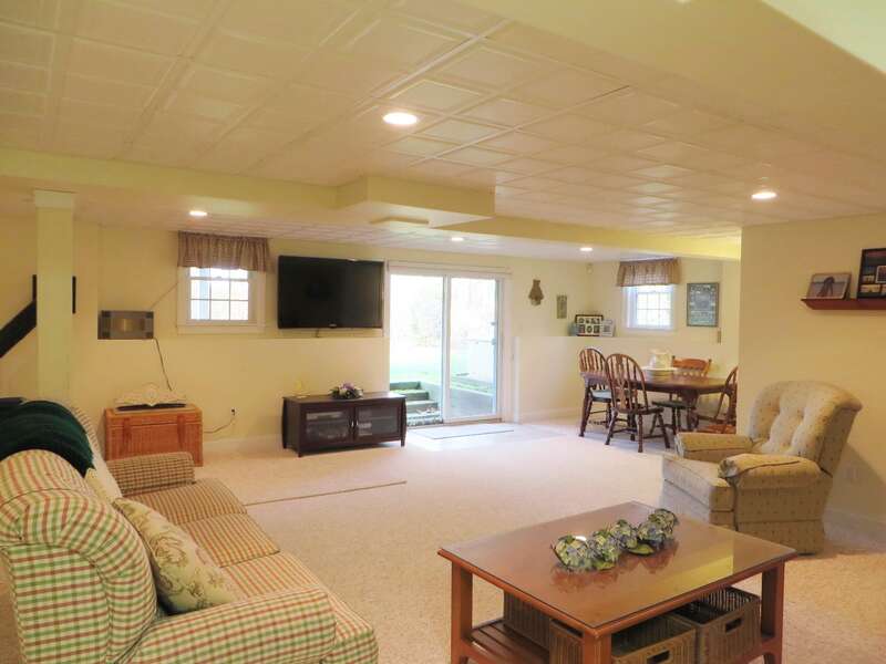 The lower level offers a flat screen TV and is a great space for the kids to watch a movie or play some board games - 2 Mashpa Road Harwich Cape Cod - New England Vacation Rentals- #BookNEVRDirectHarwichFamilyTides