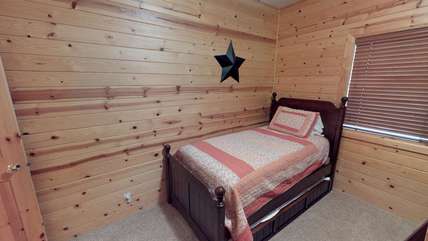 Twin bed in the kid's bedroom.