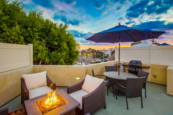 Rooftop patio with fire pit and BBQ