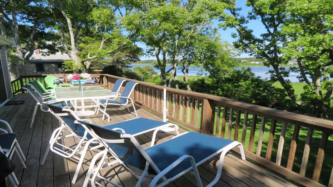 Just off the kitchen is the large deck with lounge chairs and plenty of seating! 84 Cranberry Lane Chatham Cape Cod - Ridgevale Retreat