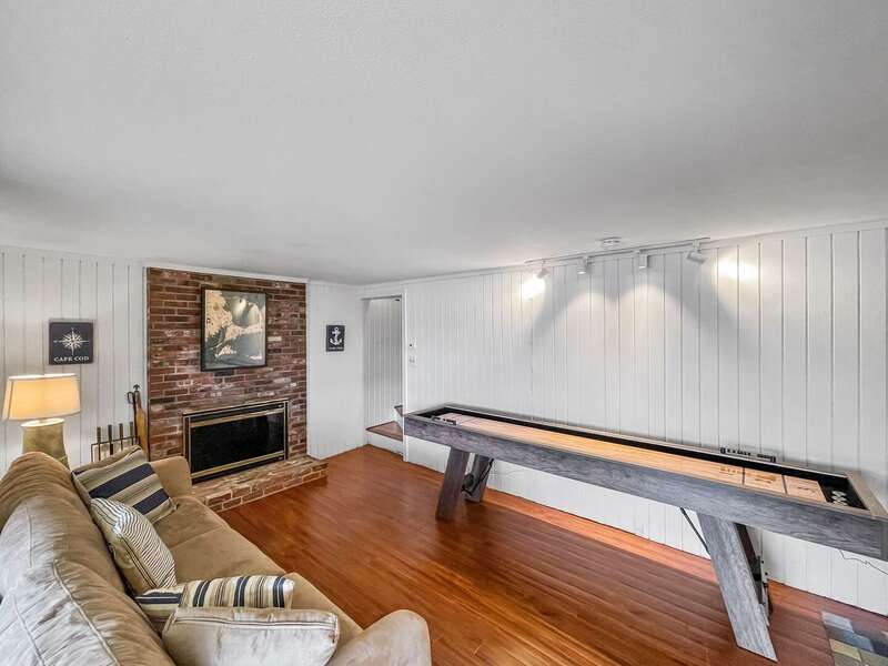 Utilize the lower level as a separate living space with connection to the back yard - 84 Cranberry Lane Chatham Cape Cod - Ridgevale Retreat