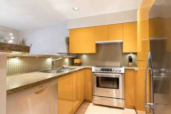 Fully Equipped Kitchen Features Granite Counters