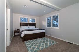 The master bedroom features a comfortable king bed