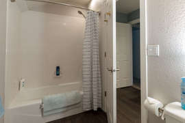 The second bathroom has a tub shower combo and a locking door for added privacy