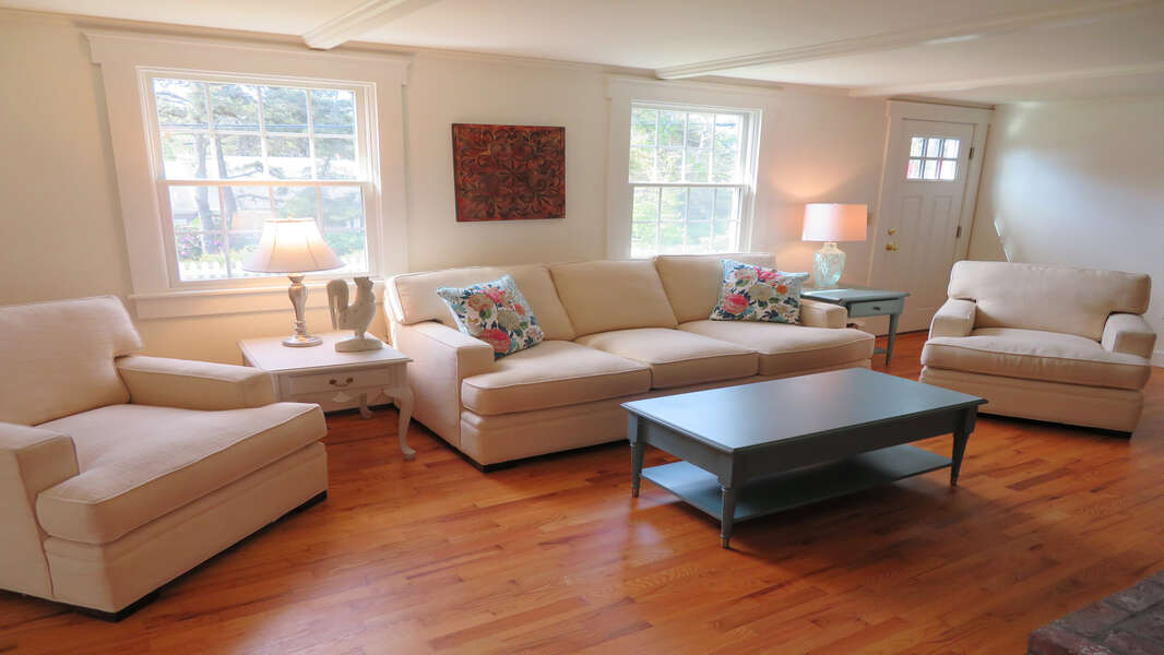 Living room with comfy furnishings. There is central air throughout - 142 George Ryder Road S Chatham Cape Cod - New England Vacation Rentals