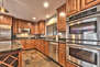 Fully Equipped Kitchen with Stainless Steel Appliances including Double Ovens and Granite Countertops
