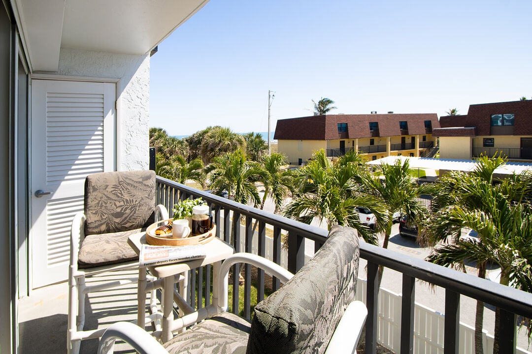 Private balcony with lush greenery and a peaceful atmosphere.