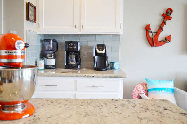 Ninja Blender AND a Keurig AND a coffee maker AND a Kitchenaid Mixer?!? Oh and in those cabinets are every kind of glass you need for a good time!