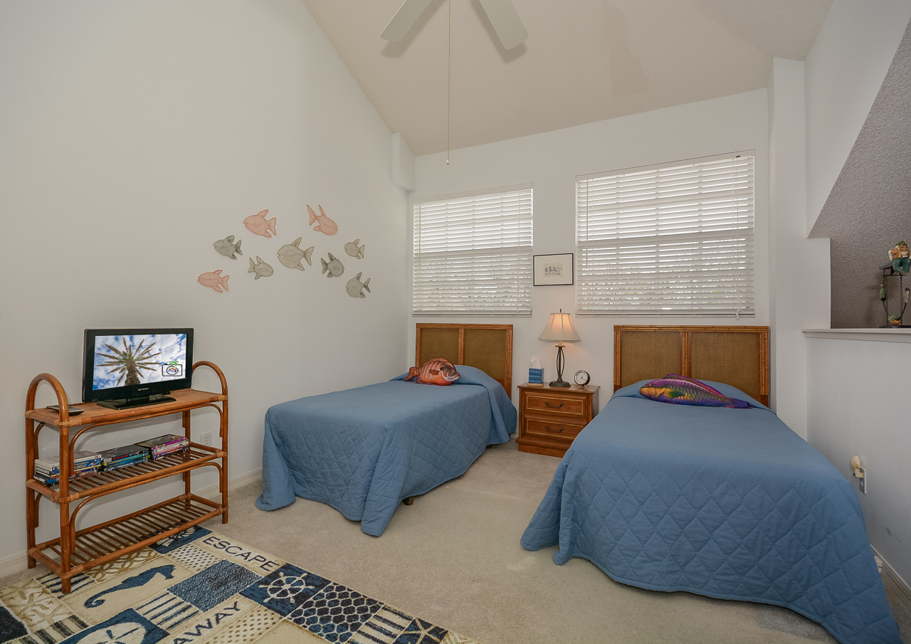 Upstairs in the loft of this Vacation Rental at New Smyrna Beach with 2 twin beds and TV.