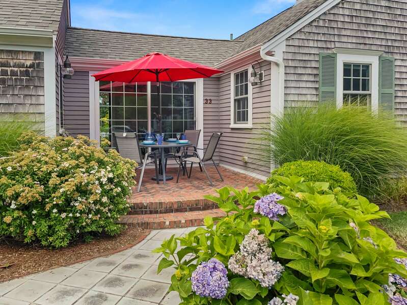 Enjoy outdoor dining on the front patio! - 33 Pine Grove West Harwich Cape Cod -  New England Vacation Rentals