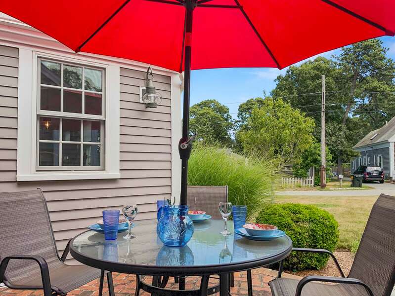 Convenient dining right outside the sliding glass doors from the interior kitchen/dining space - 33 Pine Grove West Harwich Cape Cod -  New England Vacation Rentals
