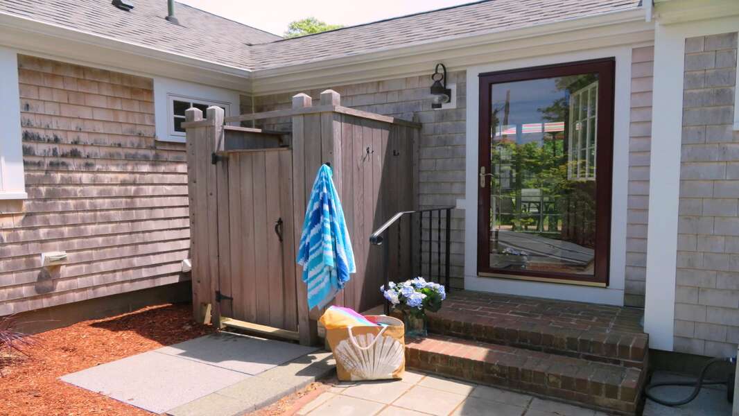 Enclosed outdoor shower with hot and cold water just off of the sunroom - 33 Pine Grove West Harwich Cape Cod -  New England Vacation Rentals