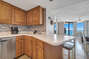 Fully equipped kitchen with updated cabinets and stainless appliances