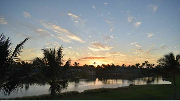Sunset views of the fairway and community pond from the lanai