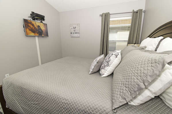 Bedroom 2 showing wall mounted flatscreen