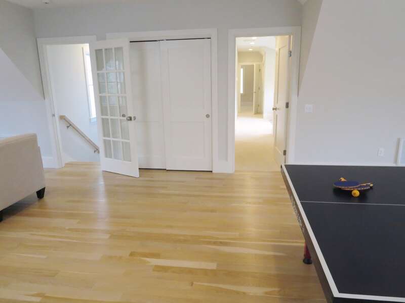 Enter the game room from the 2nd stairway or the hall-161 Bay Lane Centerville Cape Cod - New England Vacation Rentals