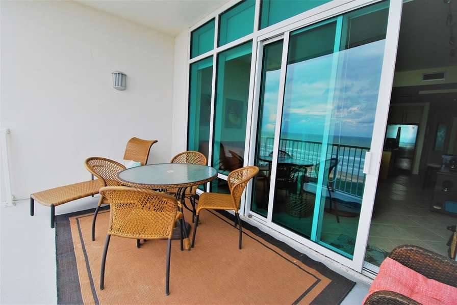 East side balcony with seating for 6 plus comfortable lounge chair - All overlooking the beach