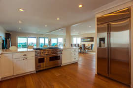 SPACIOUS FULLY EQUIPPED GOURMET KITCHEN, OPENED TO IT ALL