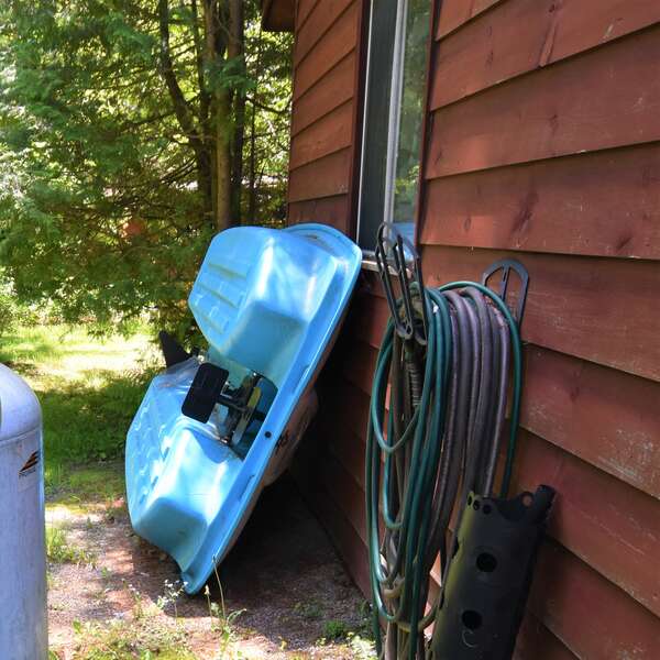 Paddleboat stored behind garage. Please carry to the water and return after each use.