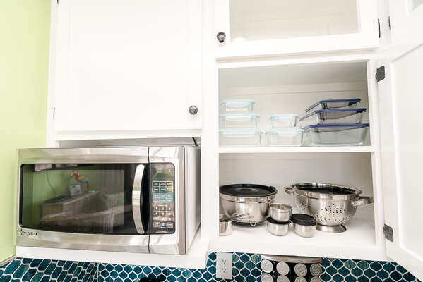 Nice bowls, measuring cups, glassware for storing leftovers- you'll be surprised at everything this kitchen has hidden in the cabinets! Super nice!!