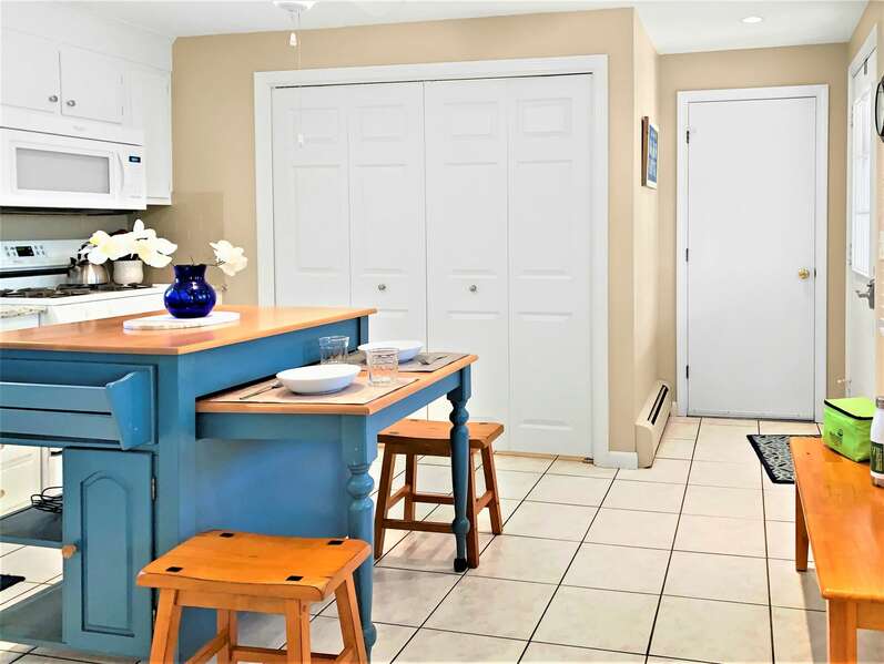 Fully equipped kitchen with convenience of the washer dryer behind double doors - 22 Muscovy Lane West Yarmouth Cape Cod - New England Vacation Rentals