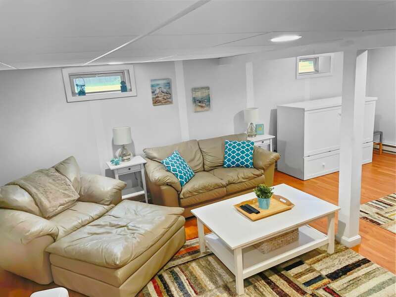 Additional living space in the basement with comfortable seating. 22 Muscovy Lane West Yarmouth Cape Cod - New England Vacation Rentals